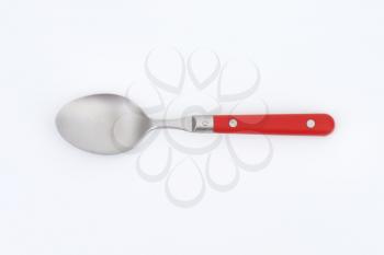 empty spoon with red handle