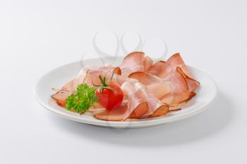 Thin slices of Black Forest ham (schwarzwald ham) on plate