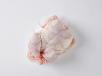 overhead view or raw whole chicken