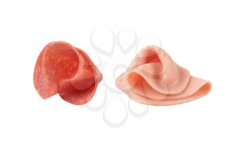 two soft salami slices on white background