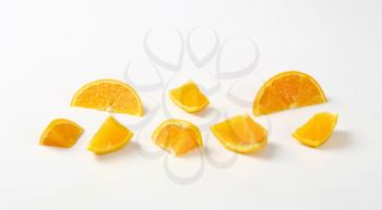 Fresh orange pieces on white background