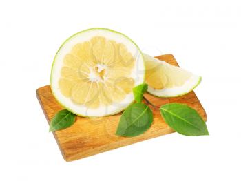 green grapefruit half and slice on cutting board