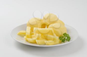 raw whole and chipped potatoes on plate