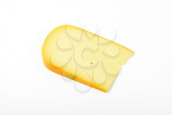 slice of gouda cheese on white background