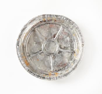 Used round tin foil cake pan on white background