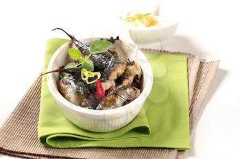 Pieces of baked mackerel in a casserole dish