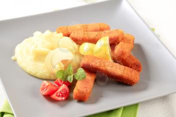 Fried fish fingers with mashed potato