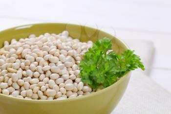bowl of raw white beans - close up