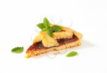 slice of strawberry jam tart on white background
