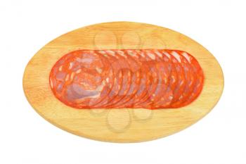 slices of chorizo salami on oval wooden cutting board