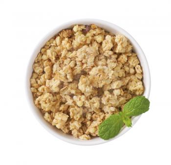 bowl of granola on off-white background