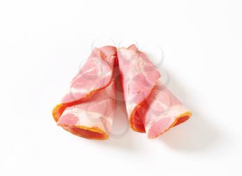 Thin slices of smoked pork neck - rolled up