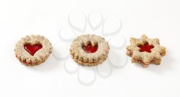 shortbread cookies with jam filling on white background