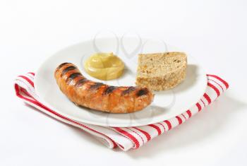 Grilled bratwurst with bread and mustard