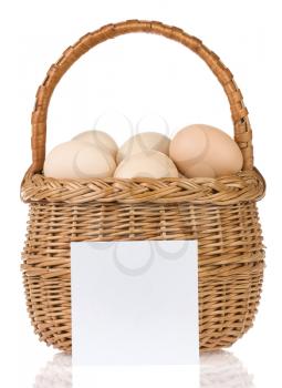 eggs and basket with price tag isolated on white background