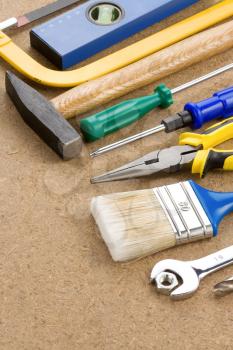 construction tools on wood background