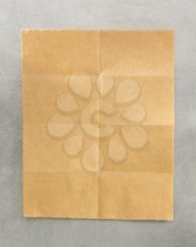 folded note paper at metal background