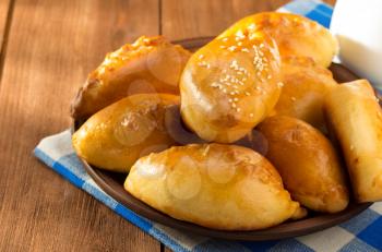 tasty pastry on plate at wooden background