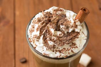 cup of coffee on wooden background