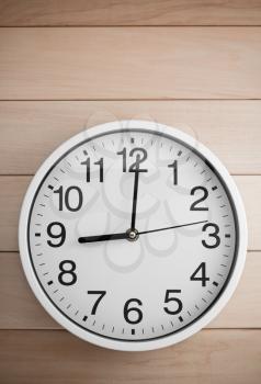 wall clock on wooden background