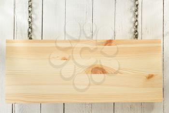 hanging signboard board on wooden background