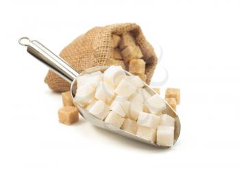 sugar cubes in scoop isolated on white background