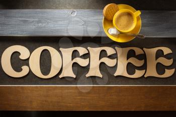 cup of coffee and letters at wooden background