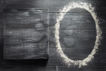 flour powder on wooden background