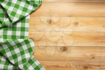 cloth napkin at rustic wooden plank board table background, top view