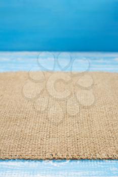 burlap hessian sacking cloth on wooden background table in front view