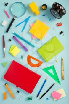 school accessories at abstract background surface
