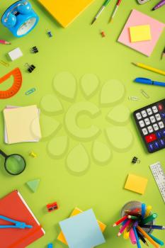 school accessories at abstract background surface