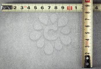 tape measure at old background texture