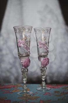 Glasses with registration by pink flowers.