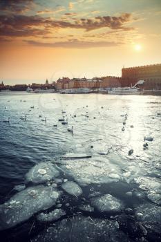 A view of Stockholm's gamla stan region from across the frozen river in winter time.
