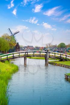 Traditional Dutch old wooden windmill in Zaanse Schans. village in Zaandam. The Netherlands.