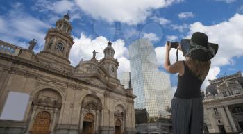 Girl traveler takes pictures of the center of Santiago. Chile
