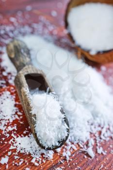 dry coconut on the wooden table, grated coconut