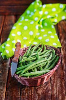 green beans in basket and on a table