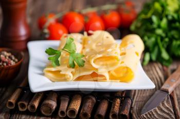 cheese on plate and on a table