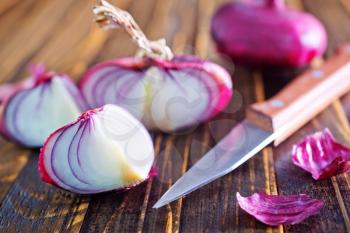 fresh onion and knife on a table