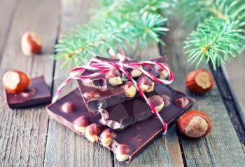 chocolate with nut and christmas tree on a table