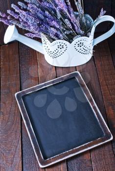 black board and fresh lavender on the wooden table