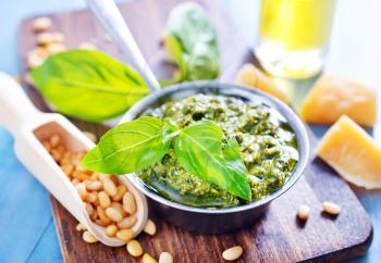 pesto sauce in bowl and on a table