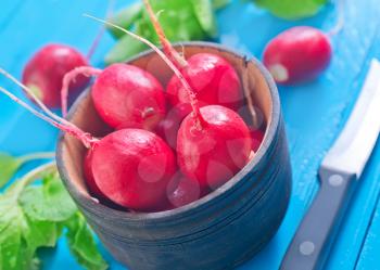 fresh radish in bowl and on a table