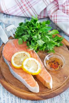 fresh salmon and lemon on the wooden board