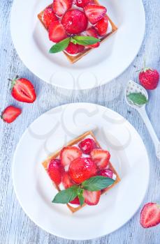 fresh cake with fresh strawberry on a table