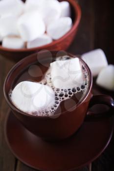  cocoa drink with marshmellow on the wooden table