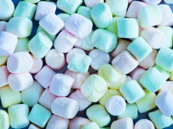 color marshmallows on the wooden table, color candy