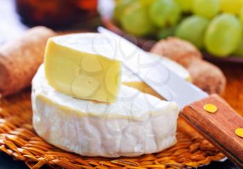 camembert cheese, cheese on the wooden table